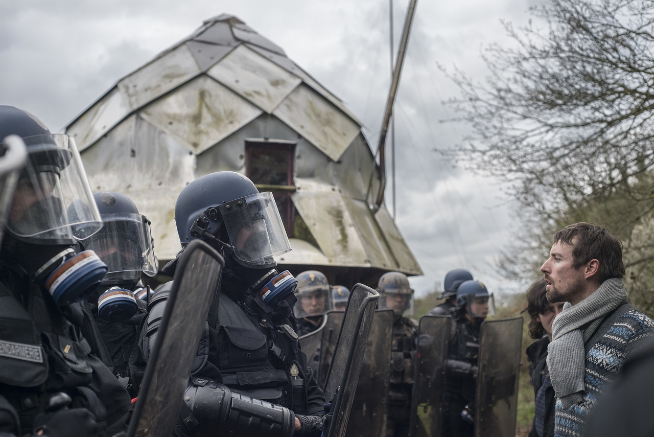 A resident faces the police, who are in the process of destroying his farm and collective during the post-victory evictions at the ZAD de Notre-Dames-des-Landes